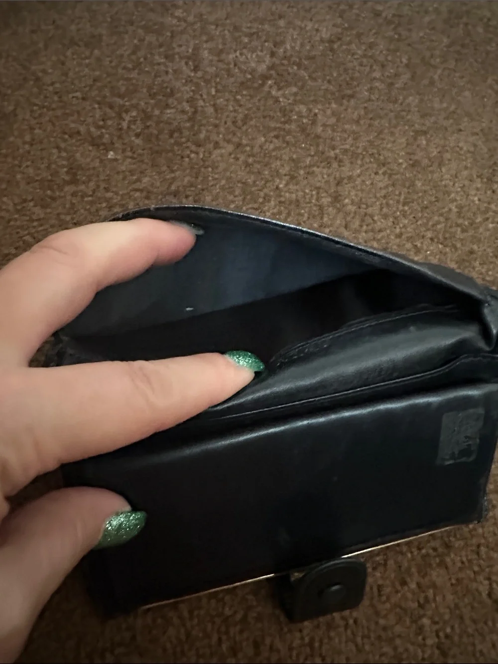 CHANEL Black Quilted CC Caviar Leather wallet.